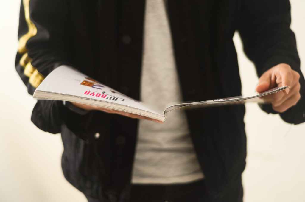 person reading magazine